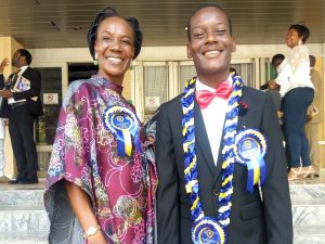 Best candidate Arotiba Seunara Peter (left) with his mother