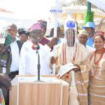 Ekiti State Deputy Governor Otunba Bisi Egbeyemi presenting the staff of office and instrument of appointment to the new Oluloro of Iloro Ekiti, Oba James Oluwafemi Olugbesoye, on behalf of Governor Kayode Fayemi at the coronation ceremony in Iloro Ekiti, Ijero Local Government. Watching are the monarch’s wife, Olori Lucia and others.