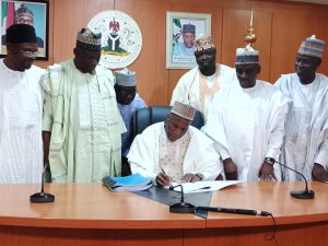 Gombe State Governor Muhammadu Yahaya signing the 2020 budget at Government House
