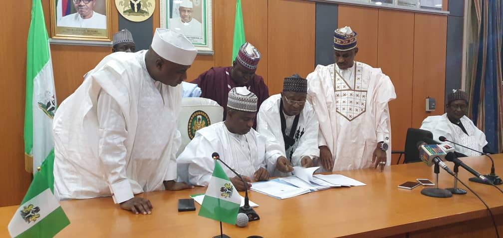 Sokoto State Governor Aminu Tambuwal signing state’s 2020 budget