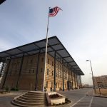 A U.S. flag flies in front of the Annex I building inside the compound of the U.S. embassy in Baghdad
