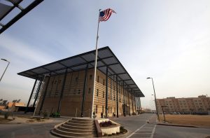 A U.S. flag flies in front of the Annex I building inside the compound of the U.S. embassy in Baghdad