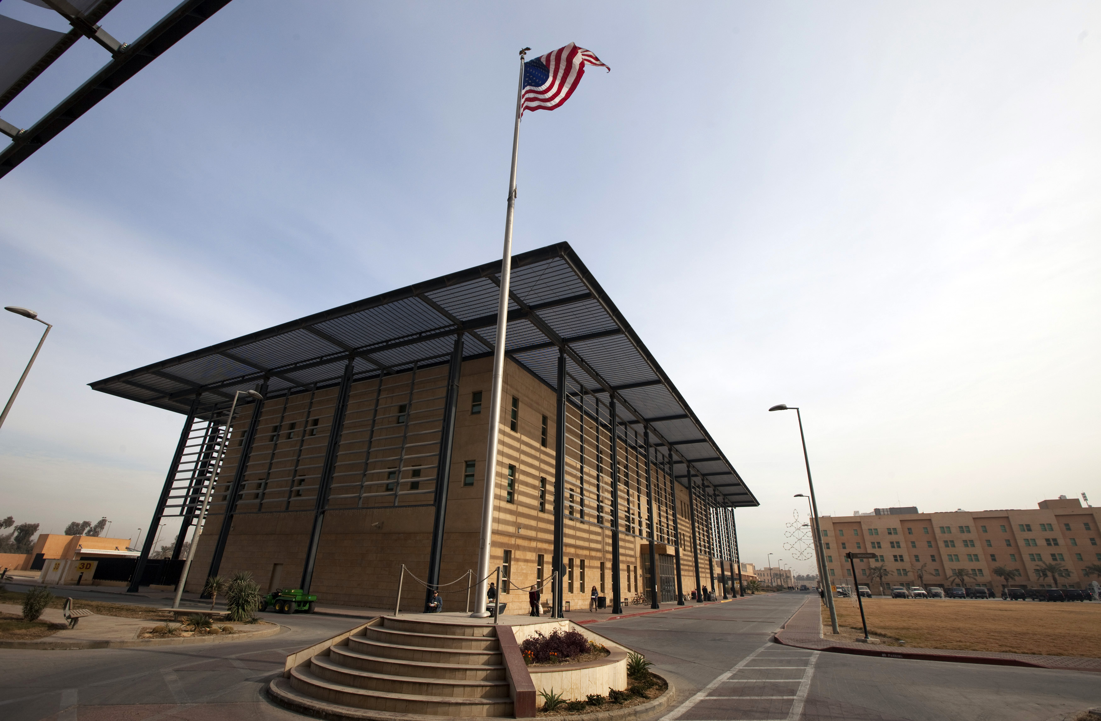 A U.S. flag flies in front of the Annex I building inside the compound of the U.S. embassy in Baghdad
