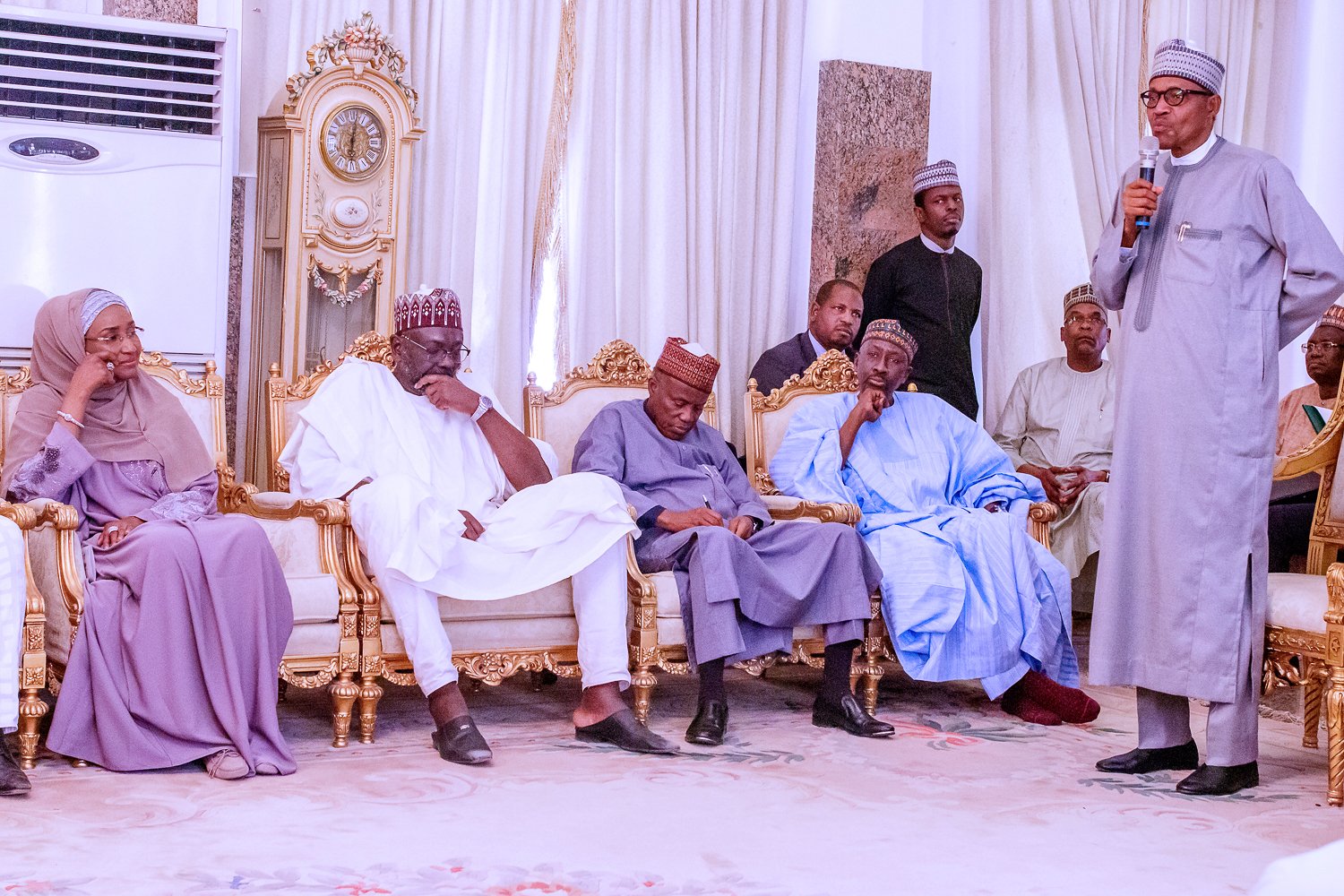 Humanitarian Affairs Minister Sadiya Umar Farouq (seated far left), President Muhammadu Buhari (standing far right)
