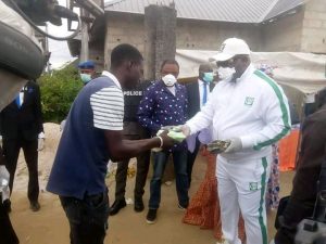 Apostle-Chinyere-presenting-food-and-money-to-one-of-the-less-privileged