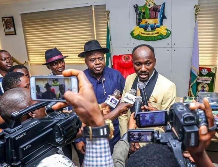 Apostle Johnson Suleman speaking at a news conference with Bayelsa State Governor Douye Diri