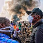 Lagos State Governor Babajide Sanwo-Olu (right) surveys the scene of the Abule-Ado pipeline fire devastation on Monday, March 16, 2020