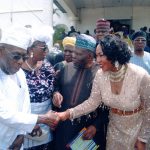 Mabel Oboh in a handshake with Obasanjo