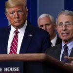US President Donald Trump listens as Director of the National Institute of Allergy and Infectious Diseases Dr. Anthony Fauci speaks during a coronavirus task force briefing at the White House, Friday, March 20, 2020, in Washington. (AP Photo/Evan Vucci)