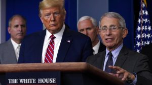 US President Donald Trump listens as Director of the National Institute of Allergy and Infectious Diseases Dr. Anthony Fauci speaks during a coronavirus task force briefing at the White House, Friday, March 20, 2020, in Washington. (AP Photo/Evan Vucci)