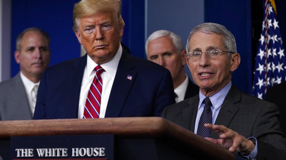 US President Donald Trump listens as Director of the National Institute of Allergy and Infectious Diseases Dr. Anthony Fauci speaks during a coronavirus task force briefing at the White House, Friday, March 20, 2020, in Washington. (AP Photo/Evan Vucci)