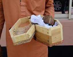 suspected internet fraudsters with mini coffin