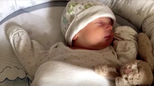 Screenshot of baby Dominic Hutton sleeping taken on April 14, 2020. (Reuters)