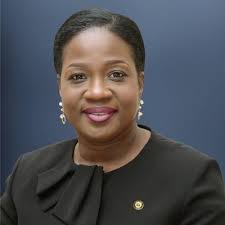 Dr Tomi Coker,
