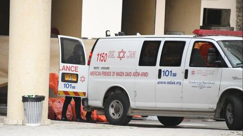 An ambulance outside a coronavirus dedicated hotel (Photo: Yair Sagi)