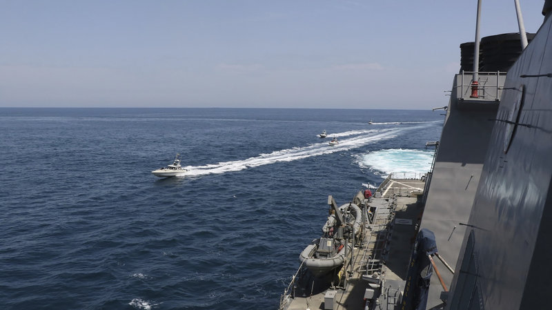 Iran’s Islamic Revolutionary Guard Corps vessels on close approach to U.S. military ships in the Persian Gulf near Kuwait, on Wednesday. (U.S. Navy/AP)