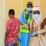 Former COVID-19 patient Mustapha Umar being handed over to the district Head of Birnin Kebbi, Alhaji Halidu Sa’adu by the Chief Medical Director of Kebbi Medical Centre Kalgo, Dr Abubakar Koko