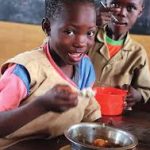 Planned home feeding for school children under fire