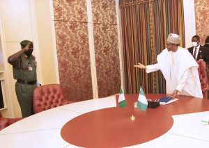 President Muhammadu Buhari (R) receives a briefing from The Chief of Army Staff, Lt General Tukur Yusuf Buratai on the activities of the Nigeria Army on security situation in the Country during a meeting at the State House in Abuja. (PHOTO: SUNDAY AGHAEZE. JUNE 8 2020)