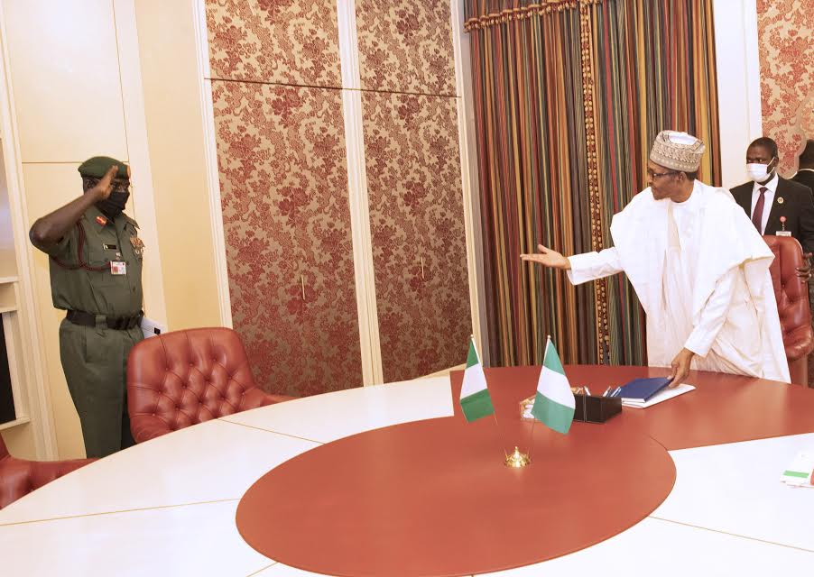 President Muhammadu Buhari (R) receives a briefing from The Chief of Army Staff, Lt General Tukur Yusuf Buratai on the activities of the Nigeria Army on security situation in the Country during a meeting at the State House in Abuja. (PHOTO: SUNDAY AGHAEZE. JUNE 8 2020)