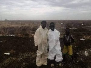 The trending photograph of two children wearing discarded PPEs trending on social media