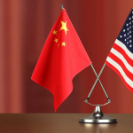 industryweek_36184_chinese_american_crossed_flag_on_desk_negotiation_studiocasper_istock_getty2