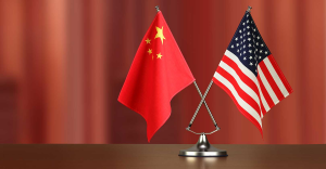 industryweek_36184_chinese_american_crossed_flag_on_desk_negotiation_studiocasper_istock_getty2