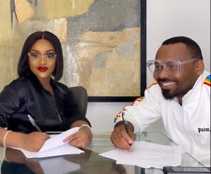Chef Chioma signing the contract