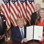 Jon Ponder (L) and his wife Jamie Ponder (R) look on as President Donald Trump signs a document granting clemency to Ponder during the virtual convention on Aug. 25, 2020. (Photo Courtesy of the Committee on Arrangements for the 2020 Republican National Committee via Getty Images)