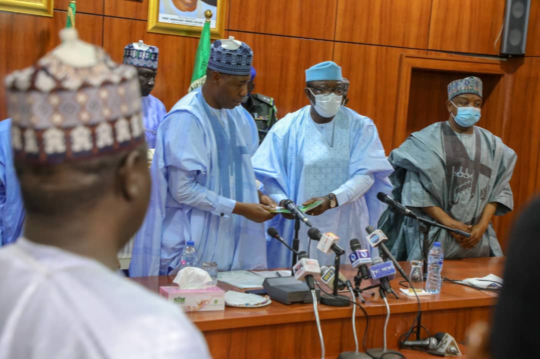 (Centre): Borno State Governor Babagana Zulum (L) and Ekiti State Governor Kayode Fayemi (R)