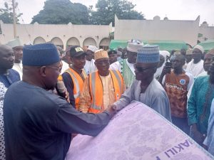 NEMA officials with House of Representatives member representing Suru/Bagudo, Hon Bello Kaoje, Chairman SEMA Kebbi and Alh Sanih Dododo with other dignitaries handing over relief materials to the affected victims