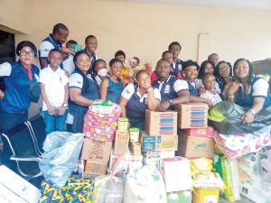 Some members of AIHSOSA’99 during the presentation of the items to the orphanage home
