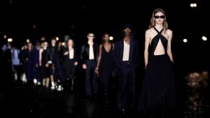 Parisian label AMI parades models by the Seine for fashion week