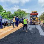 Ogun State Governor Dapo Abiodun (background in blue caftan) during a road inspection