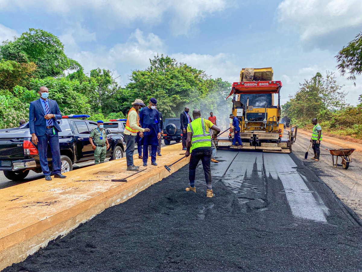 Ogun State Governor Dapo Abiodun (background in blue caftan) during a road inspection