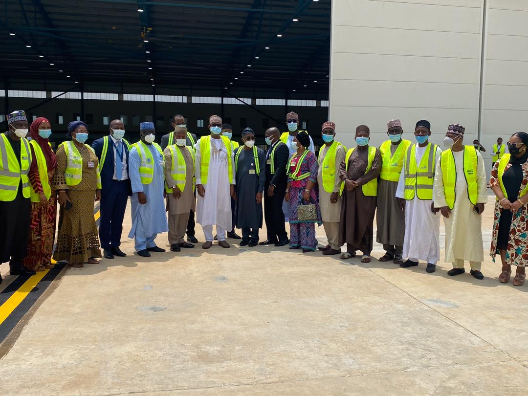 Minister of Aviation Hadi Sirika (C)