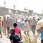 Some-youths-carrying-looted-bags-of-food-palliatives-after-they-broke-into-Plateau-government-warehouse-in-Jos-yesterday