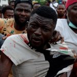 Caught armed thug who attacked #EndSARS protesters saved from mob at Alausa, Ikeja, Lagos, Nigeria on Wednesday, October 14, 2020.(Photo by Adekunle Ajayi/NurPhoto via Getty Images)