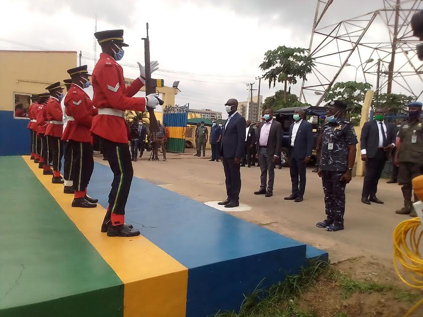 Governor Obaseki taking a salute at the Edo State Police Command