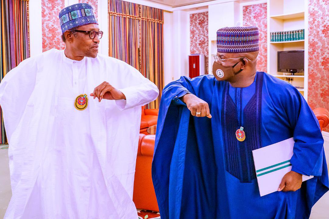 President Muhammadu Buhari (L), Kogi State Governor Yahaya Bello (R)