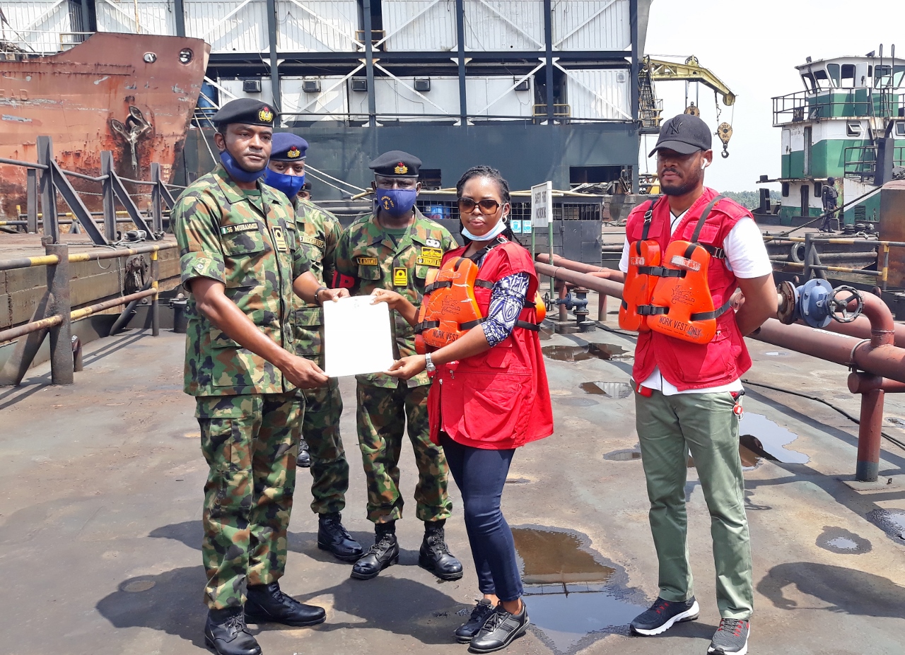 The-First-Lieutenant-Nigerian-Navy-Ship-Pathfinder-Cdr.-Suleiman-Mohammed-handing-over-a-diesel-laden-barge-to-EFFCs-Asikiye-Lot-on-Friday-in-Port-Harcourt