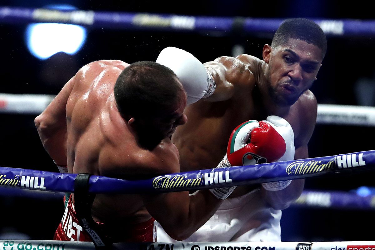 Joshua knocks out Pulev to retain heavyweight titles