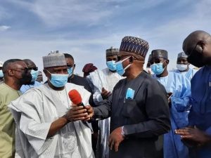 Sokoto Governor Aminu Tambuwal (L), PDP National Chairman Uche Secondus (R)