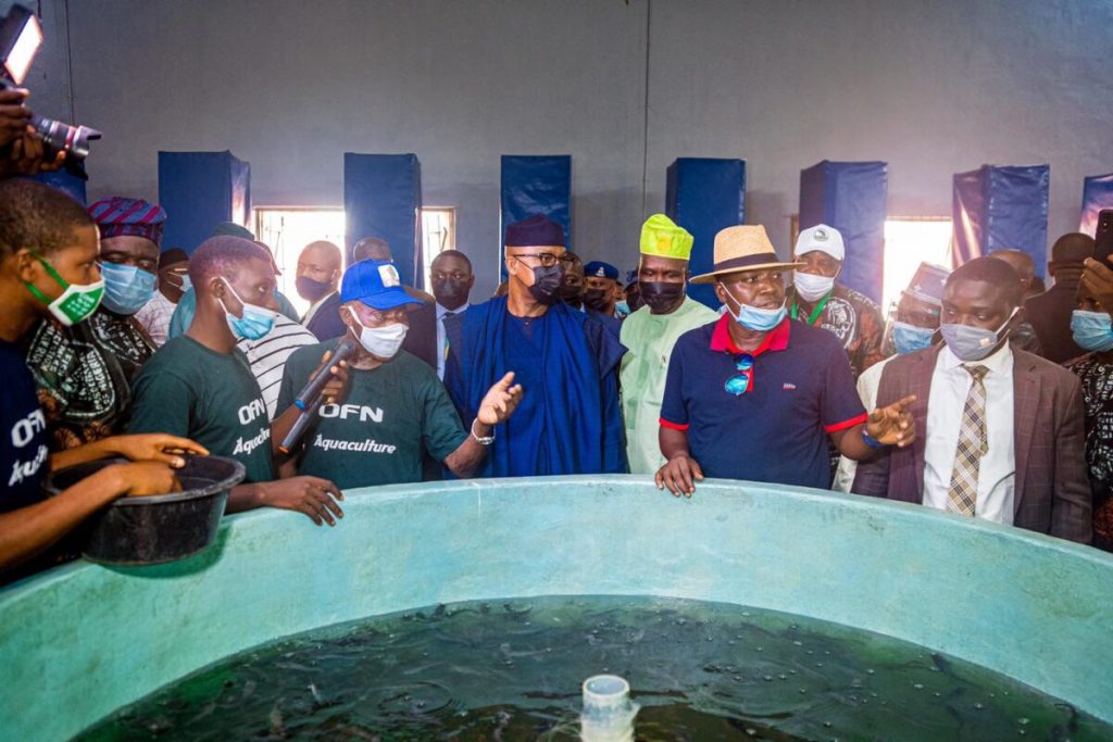 Ex-President Olusegun Obasanjo (centre left, blue cap), Ogun Governor Dapo Abiodun (centre)