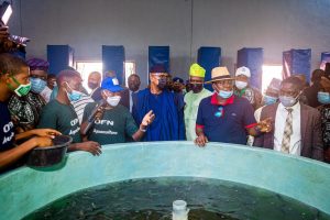 Ex-President Olusegun Obasanjo (centre left, blue cap), Ogun Governor Dapo Abiodun (centre)