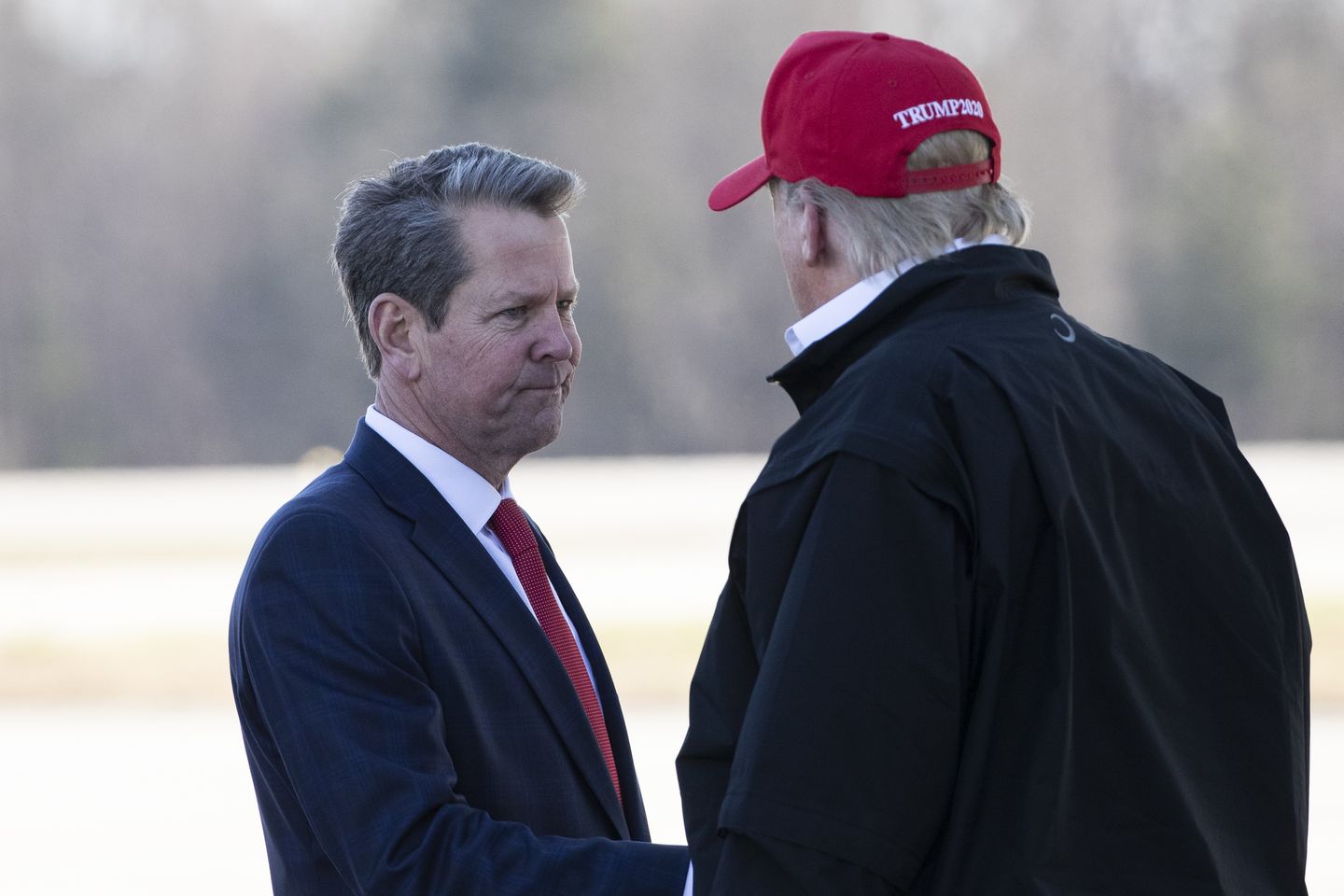 Georgia Governor Brian Kemp (L), US President Donald Trump (R)