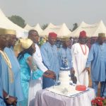 The celebrating octogenarians cutting their birthday cake