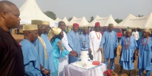 The celebrating octogenarians cutting their birthday cake