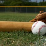 Baseball Bat and Glove on the Field