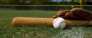 Baseball Bat and Glove on the Field
